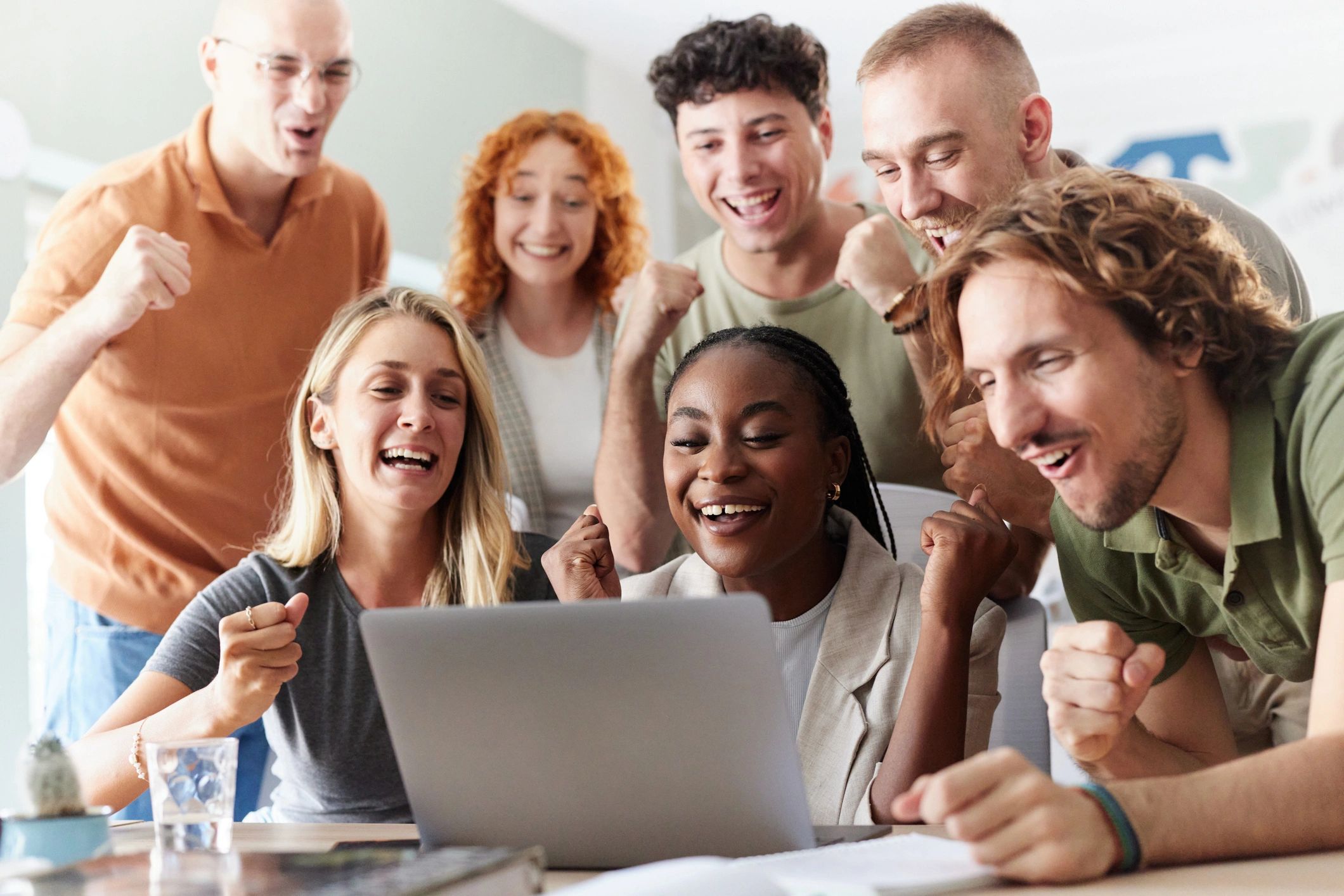 happy diverse people online earning